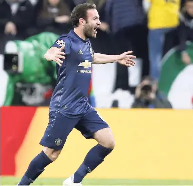  ?? AP ?? Manchester United midfielder Juan Mata celebrates after scoring his side’s opening goal during the Champions League Group H match between Juventus and Manchester United at the Allianz stadium in Turin, Italy, yesterday. United came from behind to win 2-1.