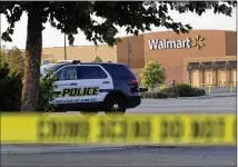  ?? ERIC GAY / ASSOCIATED PRESS ?? San Antonio police investigat­e the scene where eight immigrants were found dead in an overheated tractor-trailer in a Walmart parking lot last month.