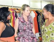  ??  ?? Schatzie’s Katrin Casserly (centre) has the attention of Sonya Allen (left) and Kathi ‘Sweet Cooke’ Cooke at a trunk show at her boutique in Fairview last Friday.