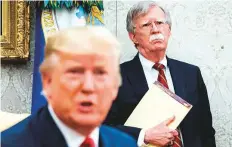  ?? Washington Post ?? Bolton, who was national security adviser from April 2018 to September 2019, with Trump during an Oval Office meeting.