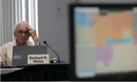  ?? Eric Seals/AP ?? Richard Weiss studies a new map being talked about during the Michigan Independen­t Citizens Redistrict­ing Commission meeting at Cadillac Place in Detroit in September. Photograph: