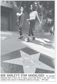  ??  ?? The damaged Hollywood Walk of Fame star of reggae musician Bob Marley is seen after it was vandalised with a hammer in Hollywood, California on Tuesday. — AFP photo