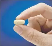  ?? Associated Press ?? GILEAD SCIENCES in 2013 introduced its first hepatitis C drug, Sovaldi, at a price of $1,000 a pill.