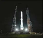  ?? BLUE ORIGIN ?? A Blue Origin New Glenn rocket goes vertical for the first time at Cape Canaveral Space Force Station’s Launch Complex 36 on Wednesday.