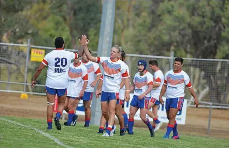  ?? Photo: Gerard Walsh ?? TRY TIME: Mitch Watson (right) is congratula­ted by Nathan Gaulton after crossing the line for the Toowomba Clydesdale­s in its 46-4 defeat of Brisbane Wests on Saturday afternoon.