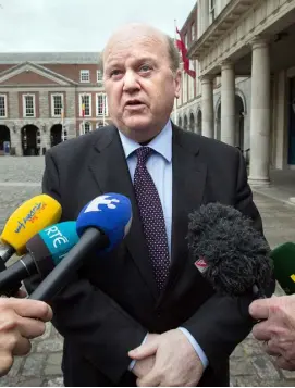  ??  ?? QUESTIONS TO ANSWER: Finance Minister Michael Noonan — the Government refused to let people bid on their own distressed mortgages