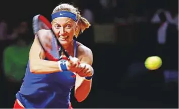  ?? Reuters ?? ■ Czech Republic’s Petra Kvitova hits a backhand shot against Germany’s Angelique Kerber during the Fed Cup world group semi-final at Porsche Arena yesterday.