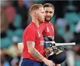  ?? Picture: Cameron Spencer/Getty ?? Ben Stokes, left, and Chris Woakes leave the field after England’s win against Sri Lanka last Saturday