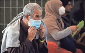  ?? OLIVIER DOULIERY, AP ?? Afghan refugees are processed Wednesday at Ramstein Air Base in Germany. About 350 refugees are expected to resettle in Columbus in the coming months.