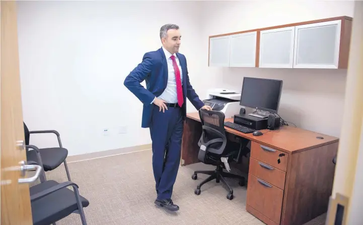  ?? ROBERTO E. ROSALES/JOURNAL ?? Raúl Torrez, Bernalillo County district attorney, stands in an office that’s part of a suite where victims can file restrainin­g orders, decompress and visit with victim assistance staffers and a therapy dog.