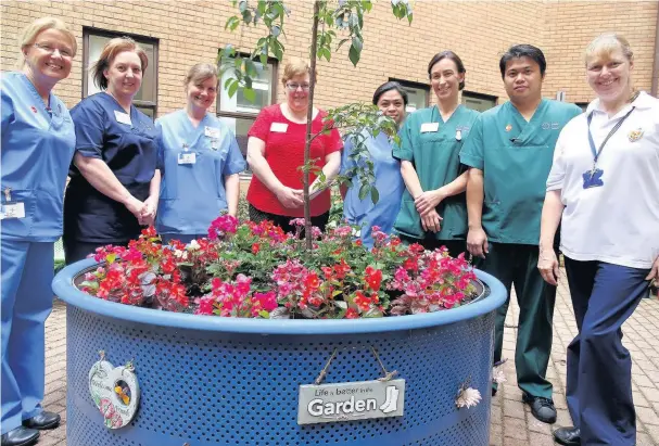  ??  ?? In the courtyard at Princess of Wales Hospital, Bridgend, are, from left, Ruth Jones, Pendre staff nurse; Sara Ralston, Ward 18, manager; Alison Morgan, Pendre staff nurse; Clare John, Ward 18 administra­tor; Fatima Detoito, Ward 18 staff nurse; Leanne...