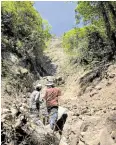  ?? —MINES AND GEOSCIENCE­S BUREAU CENTRAL LUZON PHOTO ?? SAVING LIVES The Department of Public Works and Highways is working to minimize the hazards of rockslides and landslides on Mt. Arayat, where boulders and other debris are lodged in creeks.