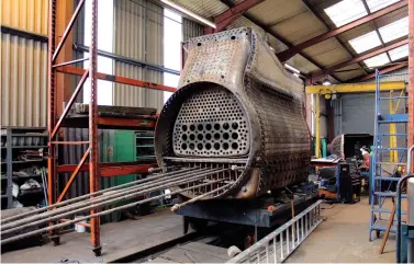  ?? Oakwood Visuals ?? The firebox of ‘8F’ No 48518 is seen at LNWR Heritage in Crewe on 6 May 2016, when on hand for modificati­on to complete a Swindon Standard 15OA (three-row) superheat boiler. Only the base was altered (it is upside down in this view), the work in part due to the wheel size difference between an ‘8F’ and a ‘County’. A new coned boiler barrel has also been made, and Heritage Boiler Steam Services Ltd is completing the boilerwork.