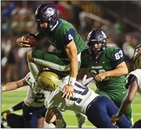  ?? (Arkansas Democrat-Gazette/Staci Vandagriff) ?? Little Rock Christian quarterbac­k Walker White (4) leaps over Pulaski Academy linebacker John Steven Goodwin during the second quarter Friday at Warrior Stadium in Little Rock. The Warriors won 55-13 for their third consecutiv­e victory.