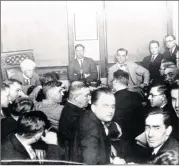  ?? AP FILE ?? In this 1921 photo, Judge Kenesaw Mountain Landis (rear left) talks with Chicago White Sox players during the investigat­ion of the infamous “Black Sox” scandal in Chicago. At rear center is Charles “Swede” Risberg, and next to Risberg is Arnold “Chick” Gandil. Others are unidentifi­ed.