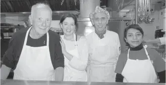  ??  ?? Left: Philanthro­pist Eric Charman, Christina Ross, chef David Pickard, and Rekha Hadi from CGI serve breakfast at Our Place.