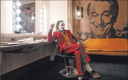  ?? Warner Bros. Pictures ?? Arthur Fleck (Joaquin Phoenix) waits backstage at Murray Franklin’s talk show in a scene from “Joker.” Robert De Niro, who portrays Franklin, also stars in the Oscar-nominated “The Irishman.”