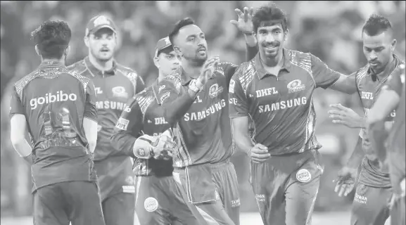  ??  ?? Jasprit Bumrah, second right, was the hero for Mumbai Indians. (Photo courtesy IPL website)