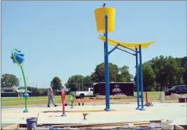  ?? TAMMY KEITH/RIVER VALLEY & OZARK EDITION ?? The splash pad in Laurel Park is nearing completion, but four shade structures haven’t arrived from a manufactur­er in Georgia, so the splash pad won’t be open for the Fourth of July, said Steve Ibbotson, director of Conway Parks and Recreation. He said the water features worked great on a test run.