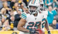  ?? DON WRIGHT/AP ?? Dolphins cornerback Xavien Howard celebrates after making an intercepti­on against the Steelers.