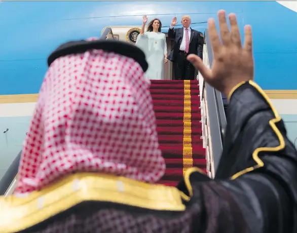  ?? AFP PHOTO/SAUDI ROYAL PALACE/BANDAR AL-JALOUD ?? U.S. President Donald Trump and Melania Trump wave as they board Air Force One before leaving Riyadh last May.