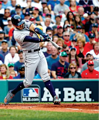  ?? Associated Press ?? ■ Houston Astros’s Carlos Correa hits a two-run homer off Boston Red Sox starting pitcher Doug Fister on Oct. 8, 2017, during the first inning in Game 3 of the American League Division Series in Boston. The two strongest areas are the middle infield where shortstop Carlos Correa and second baseman Jose Altuve, last year’s AL MVP, return to anchor the middle of the order. Correa hit .315 with 24 homers—both career-highs—last season.