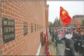  ??  ?? People queue to lay flowers at the grave of Gagarin in 2019. After Gagarin died in a training jet crash in March 1968, he was buried near the Kremlin Wall alongside Soviet leaders. (AP/Alexander Zemlianich­enko)