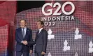  ?? Photograph: Kevin Lamar ?? the Russian foreign minister, Sergei Lavrov, greets Indonesia’s president, Joko Widodo, as he arrives for the G20 leaders’ summit in Bali.