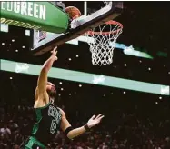  ?? Maddie Meyer / Getty Images ?? The Celtics’ Jayson Tatum scores the winning basket against the Nets in Game 1 of their playoff series Sunday.