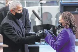  ?? Jonathan Ernst The Associated Press ?? Former President Barack Obama greets Kamala Harris, who became the first woman, first African American and first Asian American to serve as vice president.