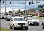  ?? NWA Arkansas Democrat-Gazette/DAVID GOTTSCHALK ?? Traffic moves Wednesday through the intersecti­on of College Avenue and Masonic Drive in Fayettevil­le. The city is developing a plan to guide developmen­t along stretches of College Avenue, Archibald Yell Boulevard and South School Avenue.