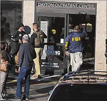  ?? MARSHALL GORBY / STAFF ?? The FBI and numerous other law enforcemen­t agencies raided the Dayton Outpatient Center in Riverside on Thursday.