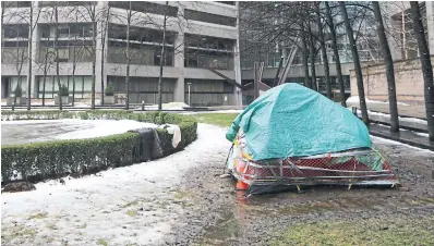  ?? R.J. JOHNSTON TORONTO STAR FILE PHOTO ?? Amid sub-zero January temperatur­es, there were 50 COVID-19 outbreaks across Toronto’s shelter system. And people wonder why those without homes don’t “just go inside,” Emma Teitel writes.