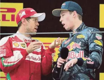  ??  ?? Red Bull’s Max Verstappen (right) has laid the blame on Ferrari’s Sebastian Vettel for the first-lap crash that ended both of their races at the Singapore GP on Sunday.