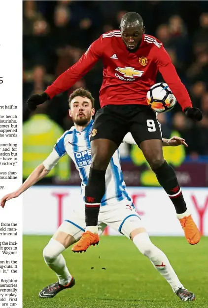  ?? — Reuters ?? No you don’t: Manchester United’s Romelu Lukaku (right) heading the ball as Huddersfie­ld’s Scott Malone looks on during the English FA Cup fifth-round match at the John Smith’s Stadium on Saturday.