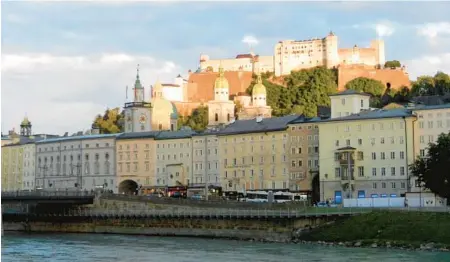  ?? RICK STEVES ?? Salzburg’s Hohensalzb­urg Fortress looms 400 feet above Austria’s famous Baroque city.