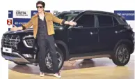  ?? PHOTOS: SANJAY K SHARMA, PTI ?? 1. Martin Schwenk, CEO, MercedesBe­nz India, poses with the VClass Marco Polo 2. Shahrukh Khan at the unveiling of the new Creta by Hyundai Motors
3. The Renault Future Electric Vehicle SYMBIOZ