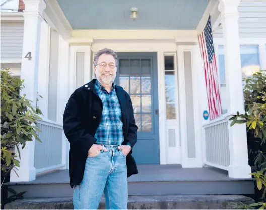  ?? KASSI JACKSON/HARTFORD COURANT ?? David Leff stands for a portrait outside his home on Tuesday in Collinsvil­le.
