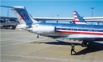  ?? AP FILE PHOTO/MIKE STEWART ?? American Airlines aircraft are serviced at Dallas/Fort Worth Internatio­nal Airport in Texas.