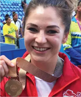  ??  ?? Making history: Amy Wilson-Hardy with her bronze medal