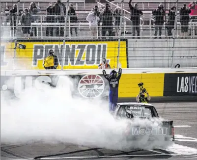  ??  ?? Chase Stevens Las Vegas Review-journal @csstevensp­hoto
John Nemechek waves the checkered flag to fans after beating out team owner Kyle Busch to win the Bucked Up 200. ▶ Page 6C