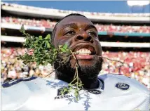  ?? CURTIS COMPTON/CCOMPTON@AJC.COM ?? Georgia Tech center Freddie Burden celebrates a win over Georgia in 2016. Burden has received an invite go to Cleveland later this week for its three-day rookie mini-camp.