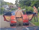  ?? PHOTO PROVIDED BY ILLINOIS STATE POLICE ?? A screenshot from dash camera video show Illinois State Police searching the car of Lamar Bell during a traffic stop on July 16 in Rockford.