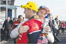  ??  ?? Jamie Whincup embraces long-time teammate Craig Lowndes.