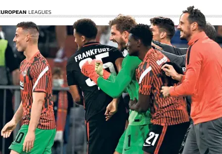  ?? AFP ?? Memorable win: Eintracht Frankfurt's goalkeeper Kevin Trapp (middle) celebrates with team members after the win against FC Bayern Munich.