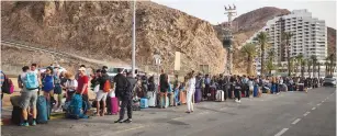  ?? (Flash90) ?? VISITORS QUEUE to enter Egypt through the Taba border crossing in Eilat this week.