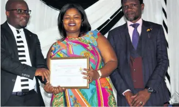  ??  ?? S Mkhize (middle) was awarded the best teacher award in geography