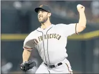  ?? RICK SCUTERI — ASSOCIATED PRESS ?? Madison Bumgarner allowed seven hits and walked three in five innings, but turned over a 2-1lead to the bullpen on Thursday.