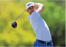  ?? MIKE CARLSON/ASSOCIATED PRESS ?? Taylor Moore follows a tee shot Sunday during the final round of the Valspar Championsh­ip. Moore edged out Jordan Spieth and Adam Schenk to earn $1,458,000 following his first career PGA Tour victory.