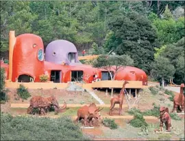  ?? Karl Mondon Bay Area News Group ?? OFFICIALS in Hillsborou­gh, Calif. contend that some of the metal animals at the “Flintstone House” are “unenclosed structures,” requiring building permits.